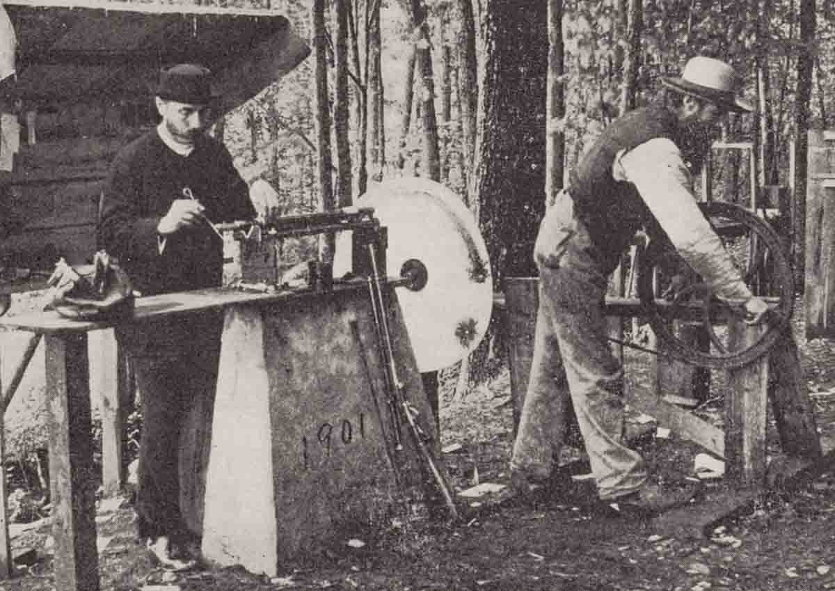 Dr. Franklin Mann (left) conducting shooting experiments at his “Shooting Gibraltar” machine rest on the Mann rifle range. From The Bullet’s Flight by Mann.